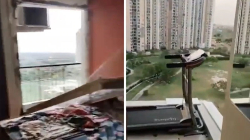 Damaged apartment window after strong wind in Noida