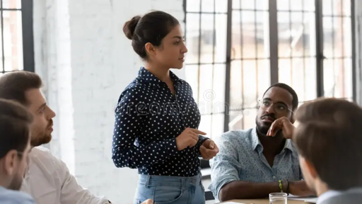 Professionals participating in a collaborative meeting and discussion in an office setting