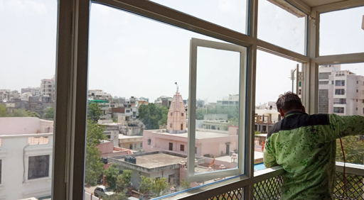 Aluminium window installation in high-rise building India