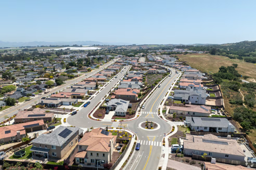Aerial view of a suburban neighborhood in Orcutt, California with single-family homes and surrounding hills