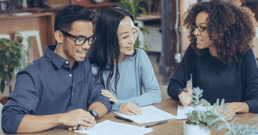 A couple meeting with a mortgage lender to review financing options