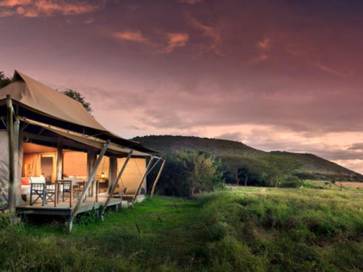 Luxury tented safari camp at sunset in Tanzania