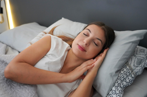 Woman sleeping peacefully representing deep sleep and blood sugar control