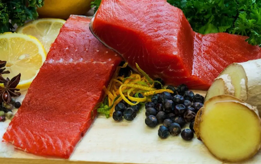 Wild sockeye salmon portions with citrus and herbs