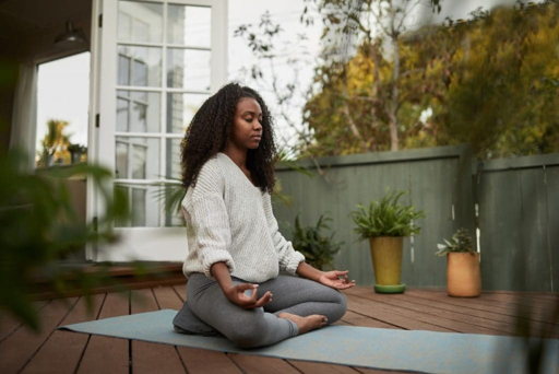 Woman meditating for mental wellness