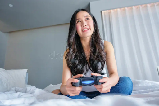Woman smiling while playing a video game