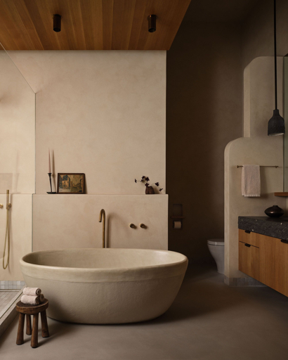 Luxury bathroom with stone bath and timber vanity