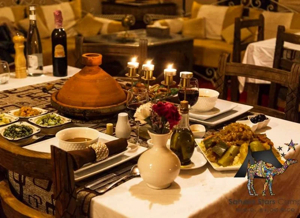 Traditional Moroccan dinner served at an Erg Chebbi desert camp in Merzouga