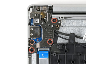Prying off laptop screen bezel with plastic tool