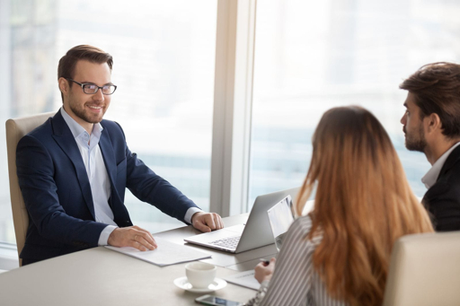 Real estate agent meeting with clients