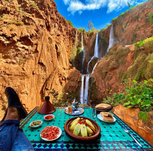 Traditional boat ride at the base of Ouzoud Waterfalls Morocco