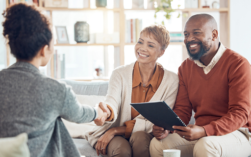 Home buyer consultation with real estate agent