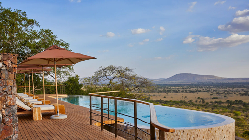 Luxury infinity pool overlooking the Serengeti savanna, Tanzania