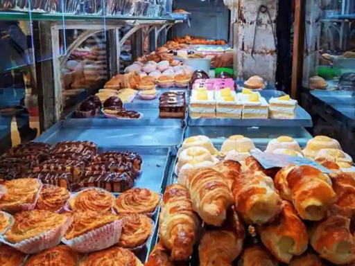 Bakery display counter with pastries in Kolkata