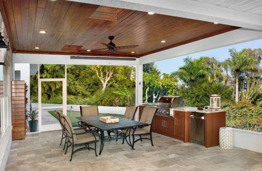 Covered outdoor kitchen and dining space in Southwest Florida