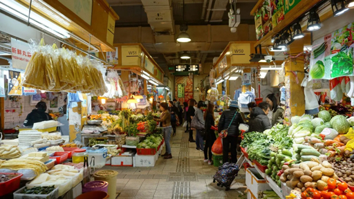 Bustling stalls inside Tai Po Market wet market, Hong Kong