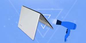 Laptop upside down drying on table
