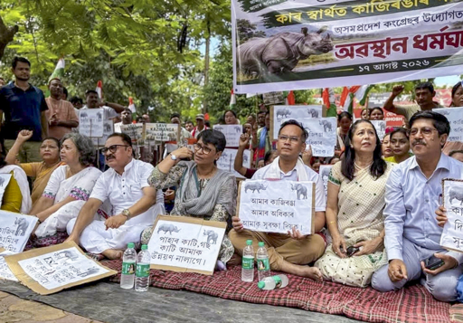 Protesters with rhino posters and Assamese/Bengali signs