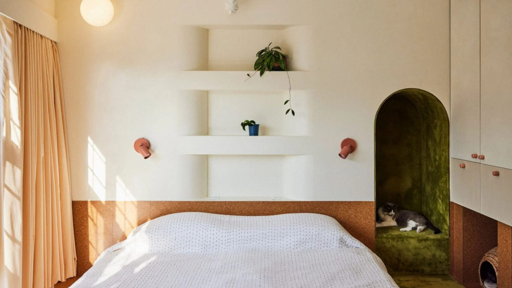 Modern bedroom with an integrated cat nook and built-in shelving