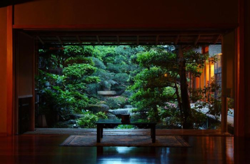 Nishimuraya Honkan ryokan exterior with traditional garden at dusk