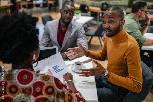 Business colleagues discussing a project in a modern office