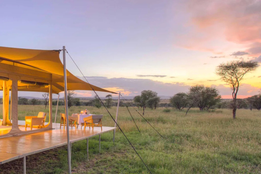 Luxury tented camp at sunset in the Serengeti, Tanzania