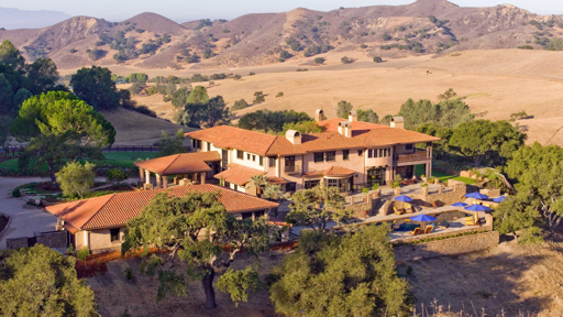 Aerial view of a ranch estate with rolling hills in the Santa Ynez Valley
